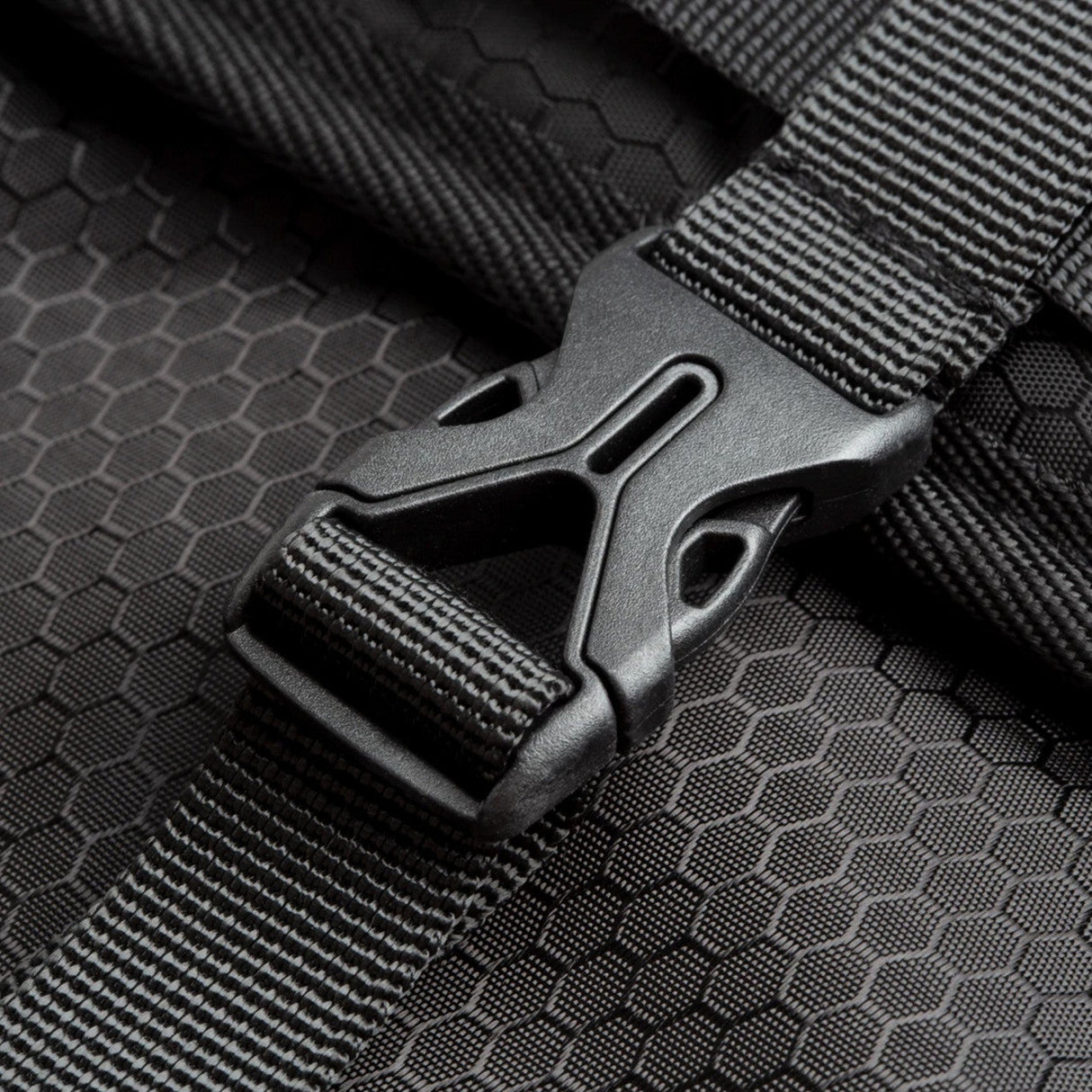 Close-up of Cali Backpack Roll Up with durable buckle on silicone material, ideal for travel