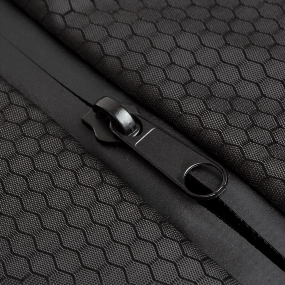 Close-up of Cali Backpack® Roll Up with silicone texture and durable zipper