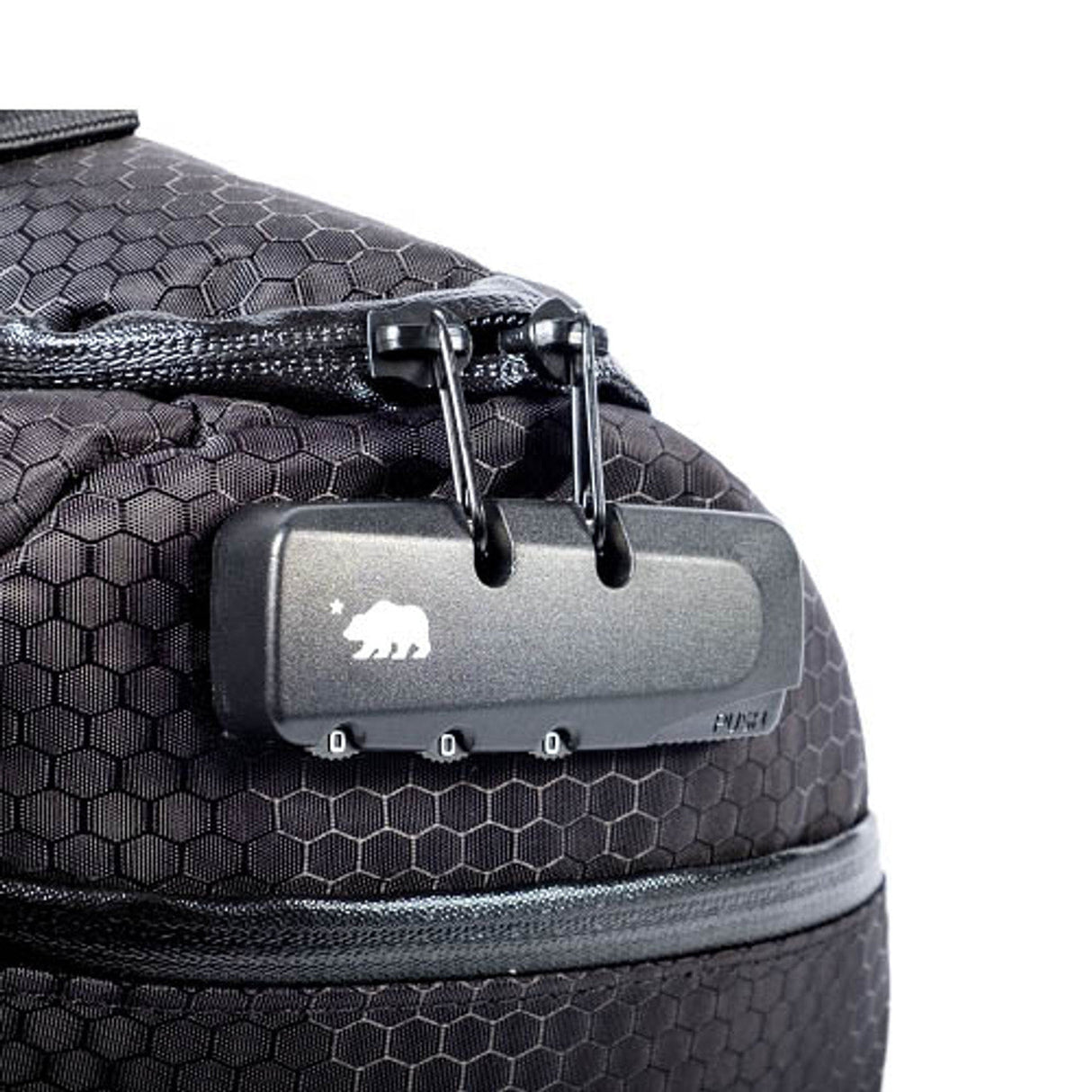 Close-up of Cali Duffle 12" Standard's zipper and logo, showcasing the durable black silicone exterior.