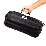 Cali Duffle 16" Standard by Cali Crusher, black silicone duffel bag, held in hand, side view