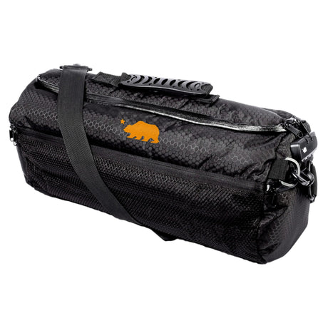Cali Duffle 16" Standard in Black/Orange with silicone texture, side view on a seamless white background