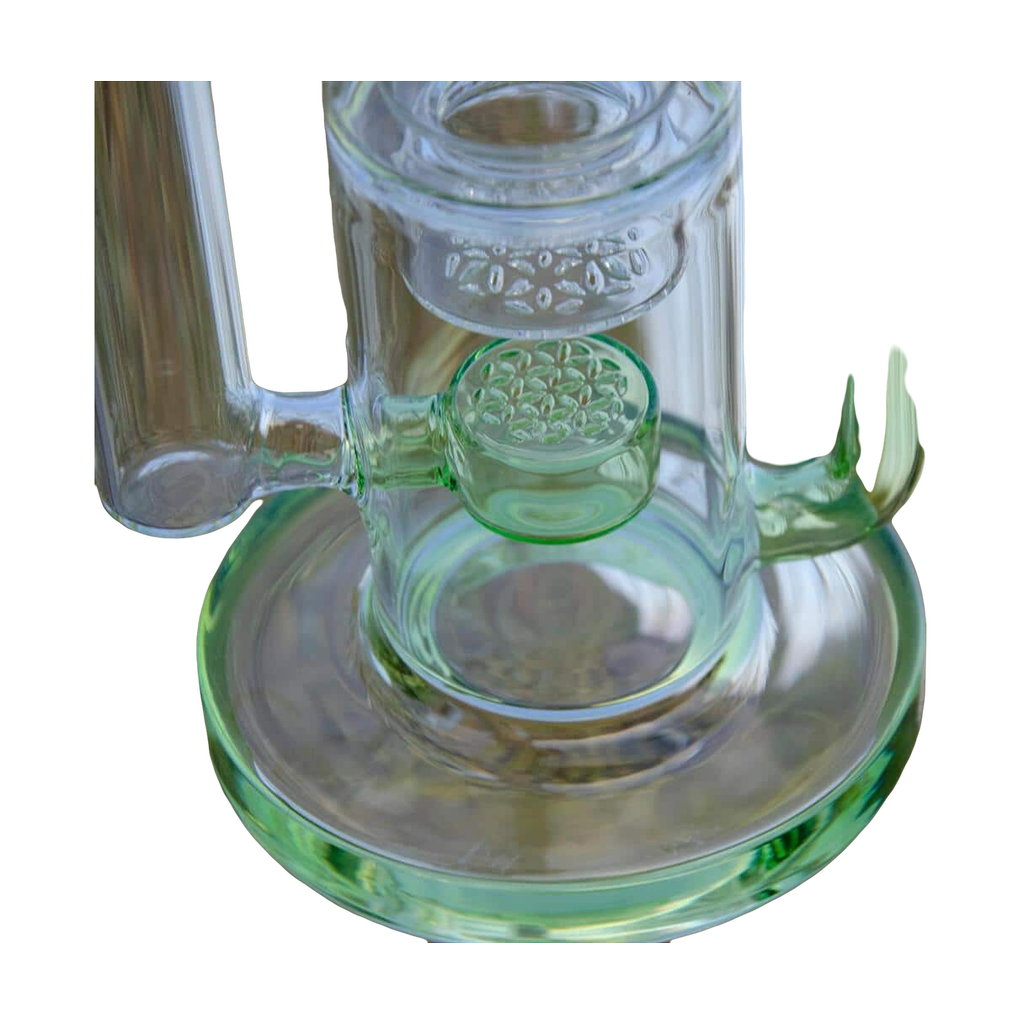 Close-up of Calibear Flower Klein Bong with clear and green glass, recycler design, and banger hanger