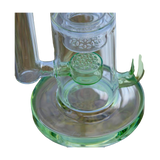 Close-up of Calibear Flower Klein Bong with clear and green glass, recycler design, and banger hanger