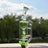 Calibear Puffco Attachment Klein in Lime Green, outdoor side view showcasing sleek design