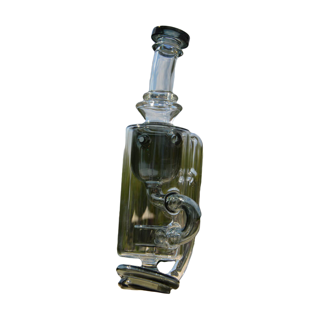 Calibear Puffco Attachment Klein in clear glass with green accents, outdoor side view