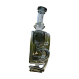 Calibear Puffco Attachment Klein in clear glass with green accents, outdoor side view