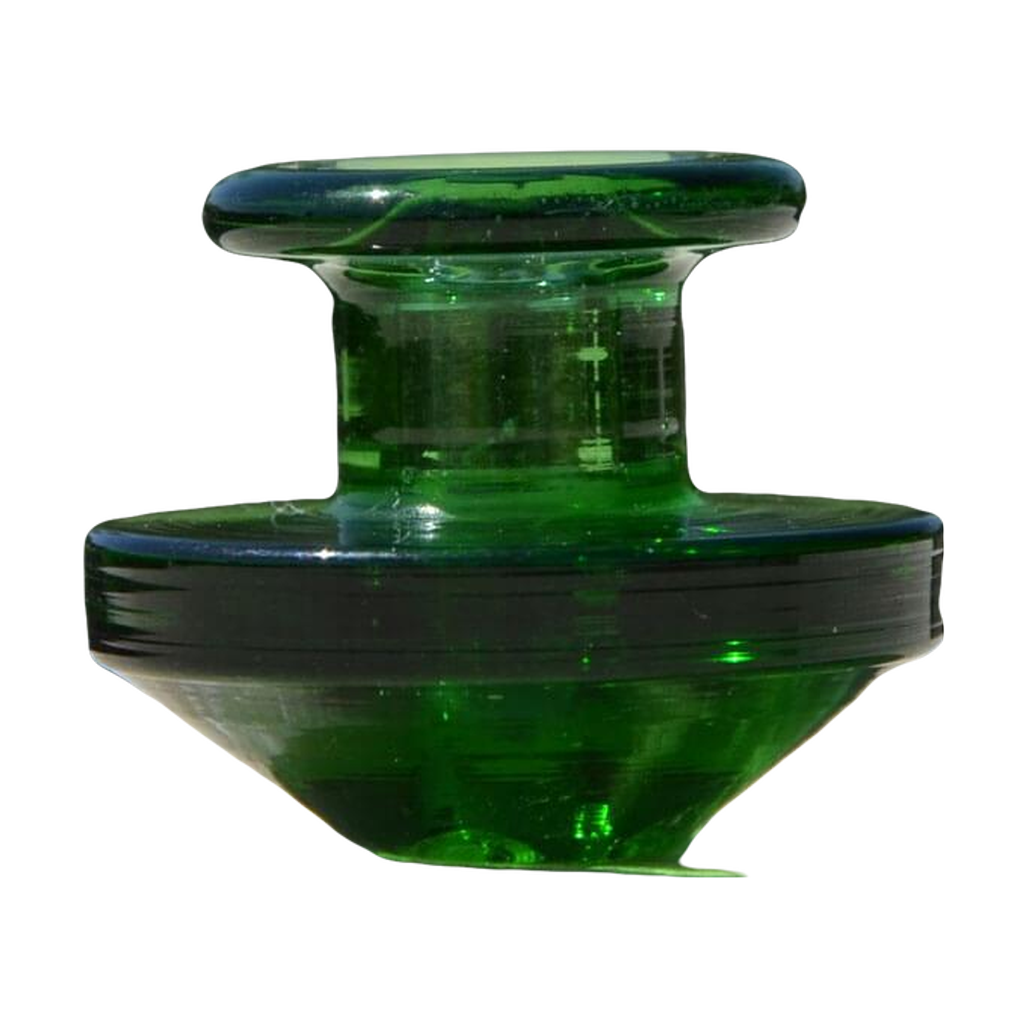 Calibear Puffco Peak Carb Cap in green glass, compact design for dab rigs, outdoor side view