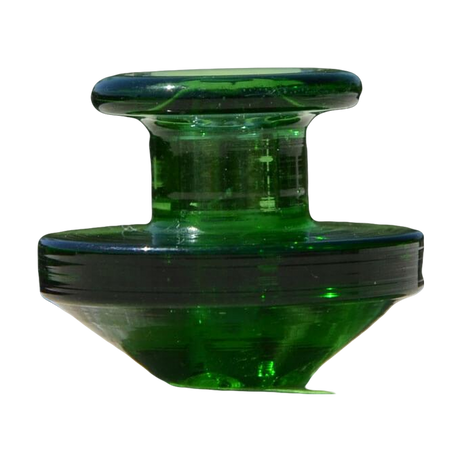 Calibear Puffco Peak Carb Cap in green glass, compact design for dab rigs, outdoor side view
