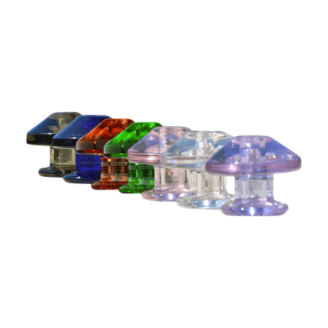 Assorted Calibear Puffco Peak Carb Caps in various colors, angled view on white background