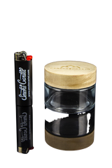 Canada Puffin Jasper Wooden Lid Storage Jar beside Clipper Lighter on Black Background