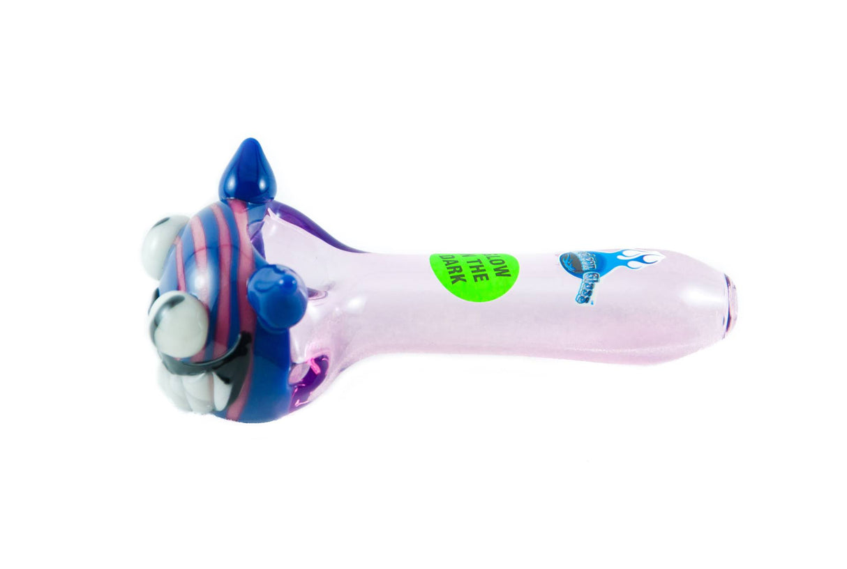 Chameleon Glass Cheshire Cat themed hand pipe that glows in the dark, side view on white background