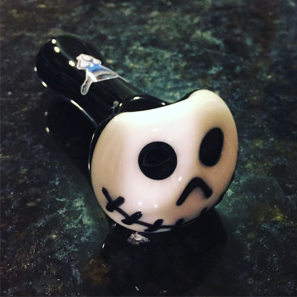 Chameleon Glass Skellington Hand Pipe with Glow in the Dark Feature, Angled View