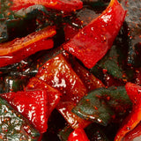 Close-up of Chilli Bomba Double Sour Belts 8oz with vibrant red and green colors