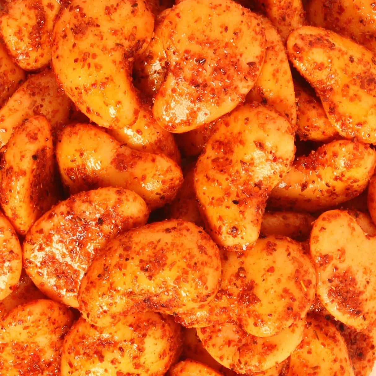 Close-up of Chilli Bomba Spicy Mango Gummies 8oz with tangy coating