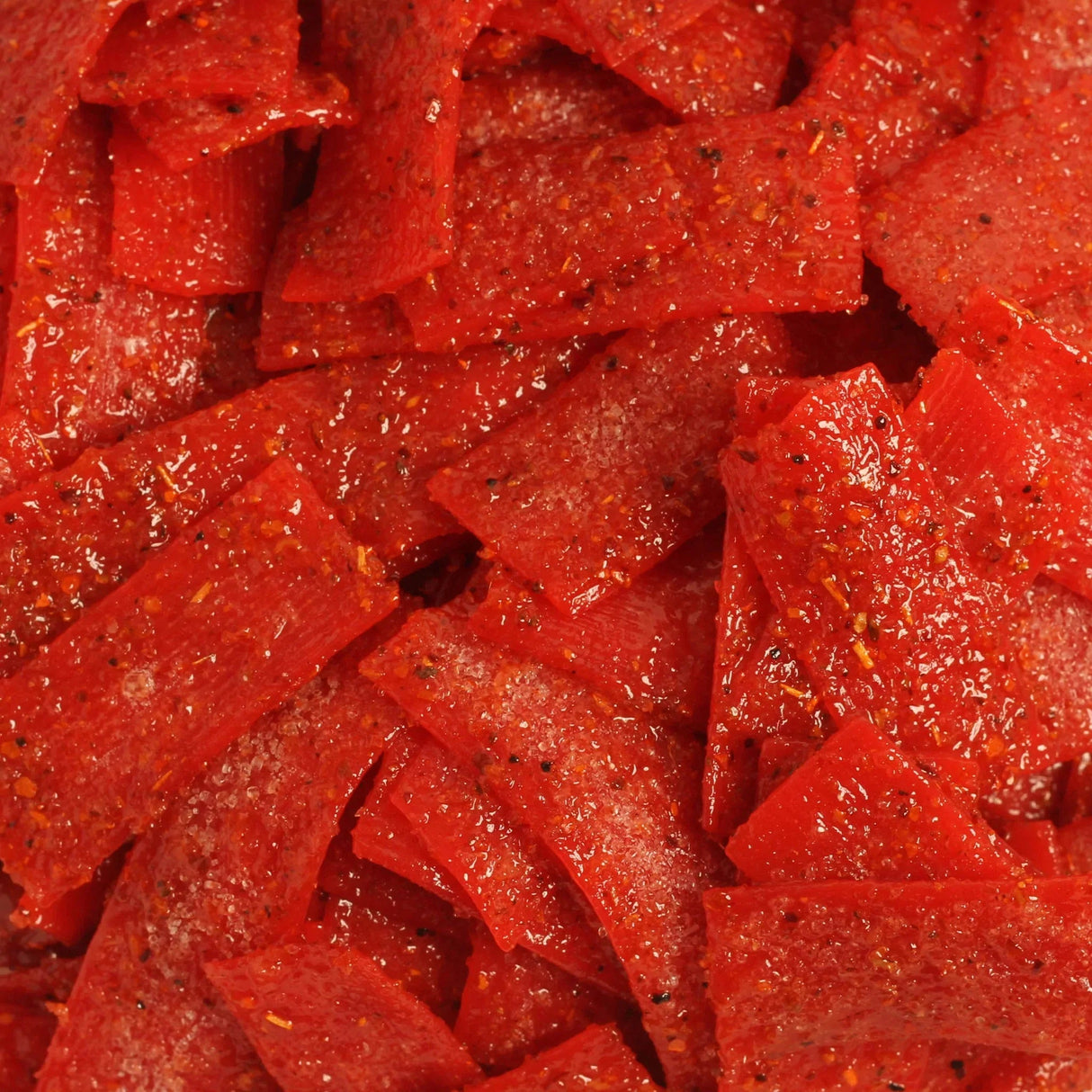 Close-up of Chilli Bomba Strawberry Belts 8oz with sugar crystals