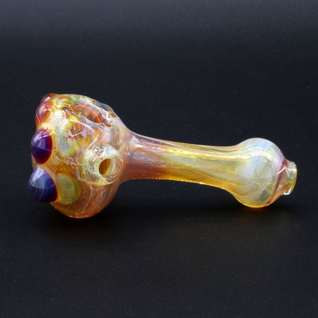Clayball Glass "Amber Flame Nebula" Heady Spoon Hand-Pipe with intricate color design on black background