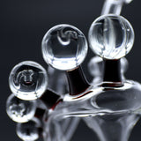 Close-up of Clayball Glass "Crimson Dreams" Heady Recycler Dab-Rig showing intricate glasswork