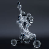 Clayball Glass "Electric Moon" Heady Recycler Dab-Rig, intricate design, front view on dark background