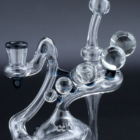 Clayball Glass "Electric Moon" Heady Recycler Dab-Rig with intricate glasswork, front view on a black background