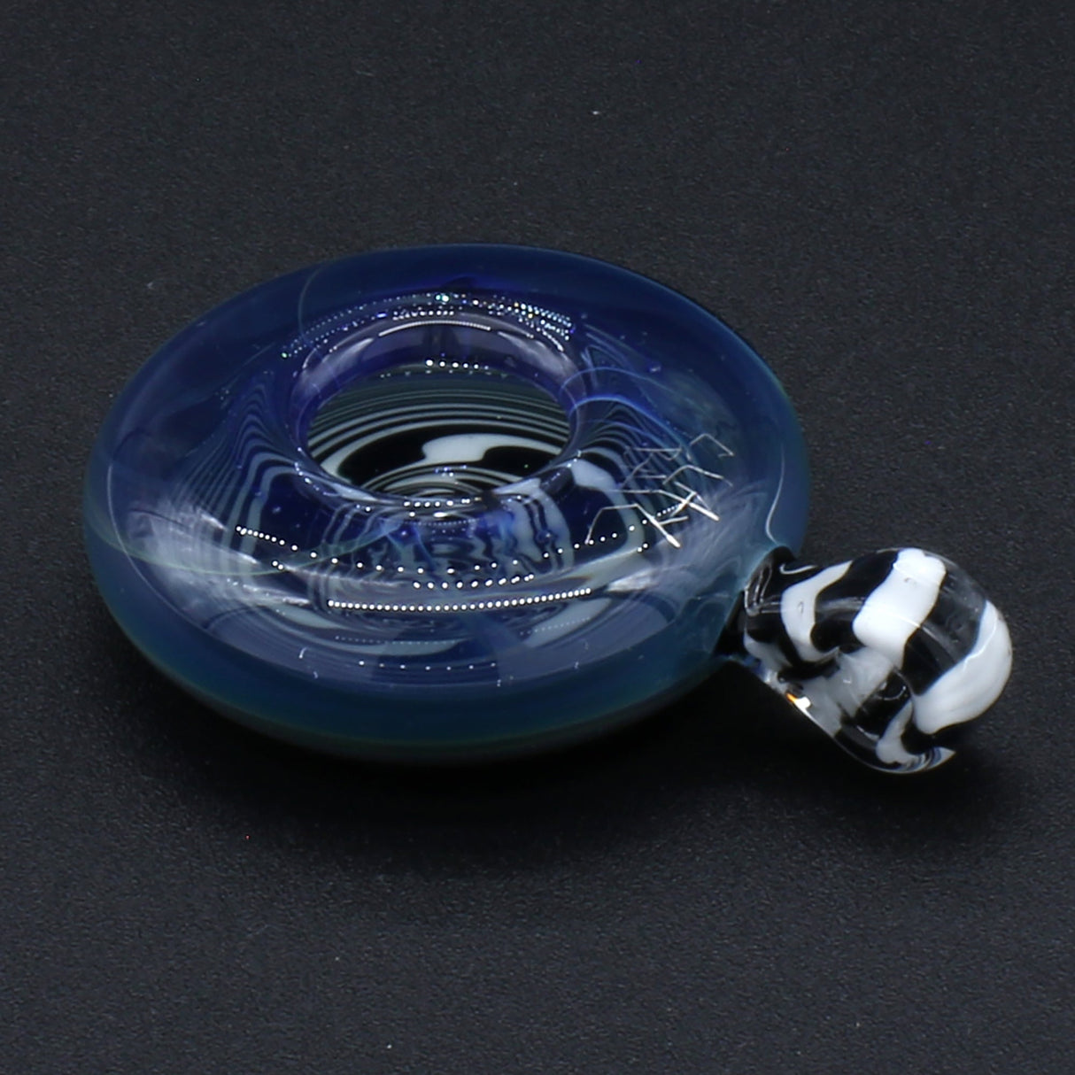 Clayball Glass 'Enter the Void' Reversal Glass Pendant on black backdrop, intricate design, 2" diameter