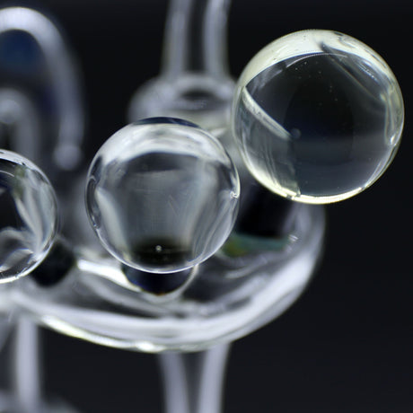 Close-up of Clayball Glass "Milky Way" Heady Recycler Dab-Rig with intricate glasswork