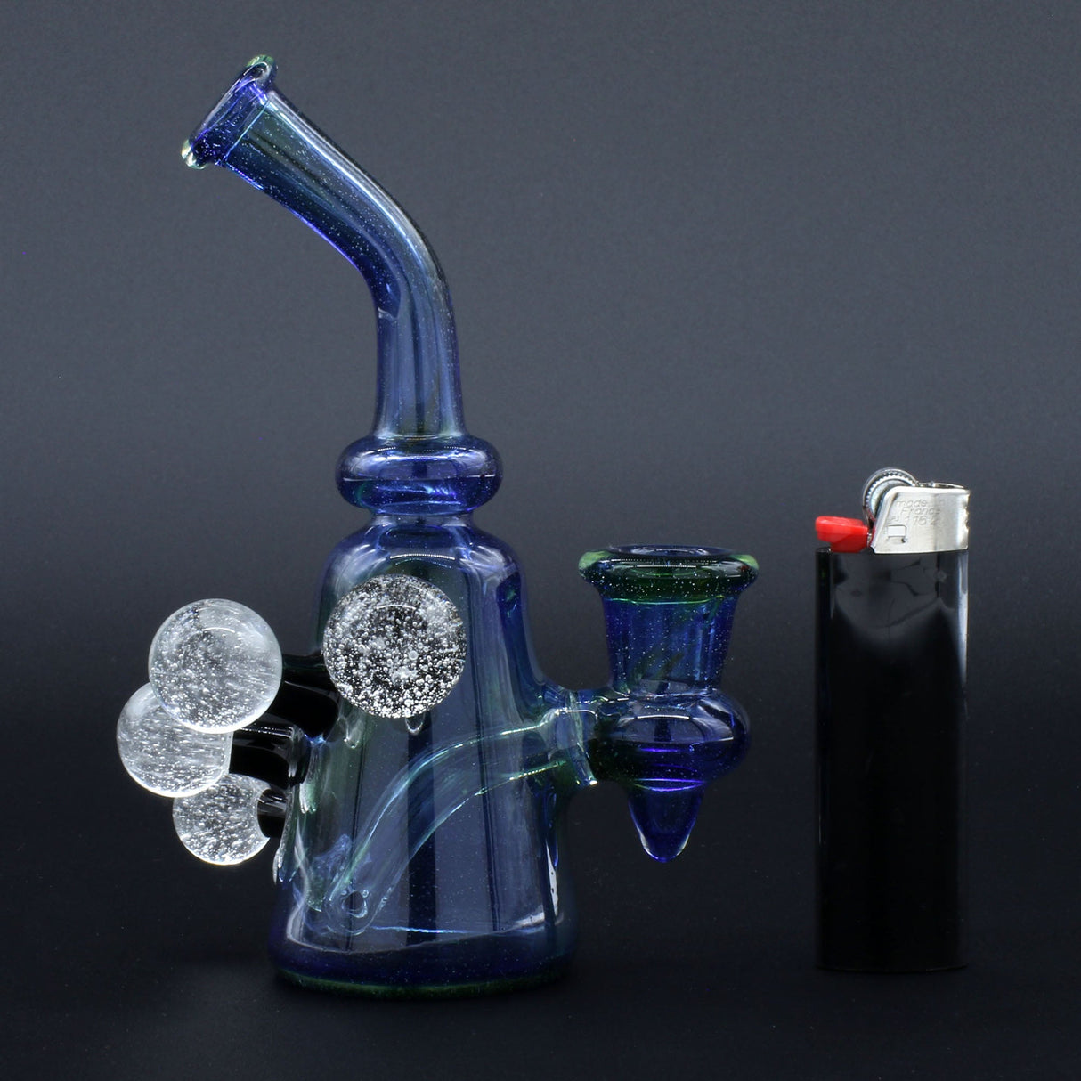 Clayball Glass "Super Nova" Heady Sherlock Dab Rig with intricate glasswork, side view next to a lighter