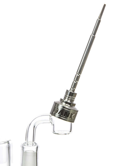 Dank Tools Titanium Carb Cap/Dabber attached to a dab rig, close-up side view