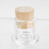 Empire Glassworks UV terp pearls in reusable glass container carb cap stand