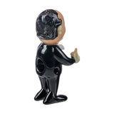 Empire Glassworks hand pipe with a caricature design, heavy wall, for dry herbs, side view.