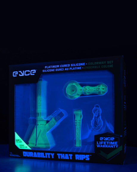 Eyce Colorway Boxed Set glowing in the dark, showcasing durable silicone bong and accessories