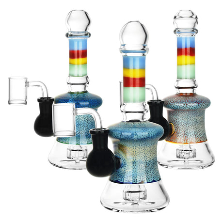 Three Far-Out Flower of Life Dab Rigs with colorful accents and borosilicate glass, front view