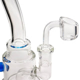 Glassic Stacked-Cake Dab Rig with blue accents and 90-degree banger hanger, close-up side view