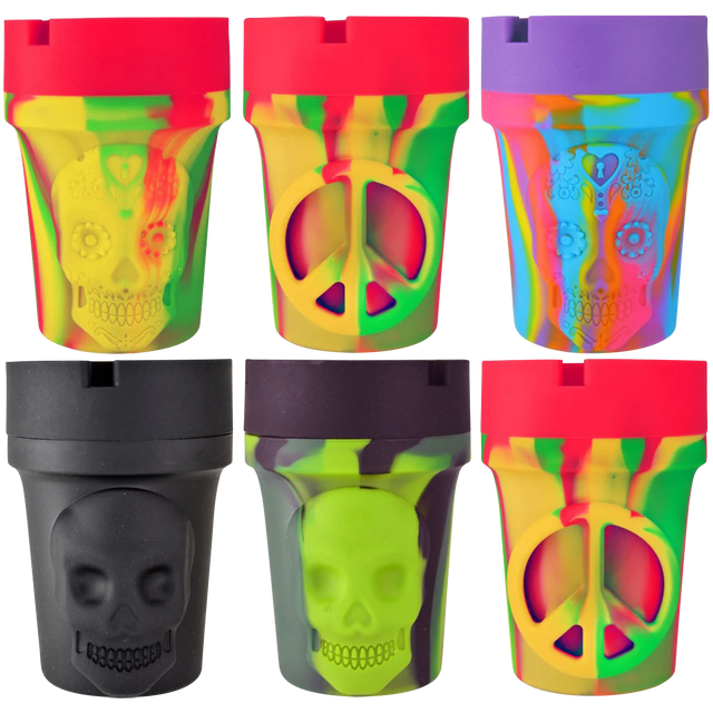 Assorted glow-in-the-dark silicone ashtrays with skull designs, 6 pack, front view