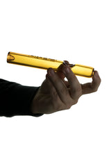 GRAV Classic Steamroller in Amber - Hand holding a 7" borosilicate glass pipe, side view