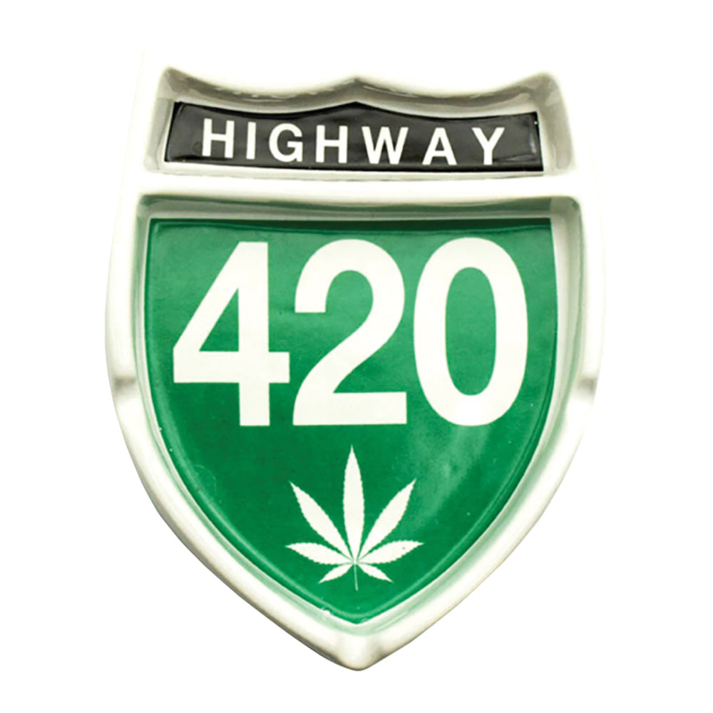 Highway 420 shield-shaped ceramic ashtray with cannabis leaf emblem, front view on white background