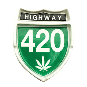 Highway 420 shield-shaped ceramic ashtray with cannabis leaf emblem, front view on white background