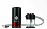 Hitoki Trident Laser Water Pipe 2.0 in Black, side view with transparent water chamber and hose
