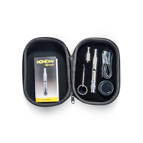 HoneyStick Aficionado Kit with vaporizer, dab tool, USB charger, and silicone container, top view