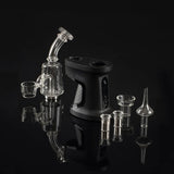 Ispire daab Induction eRig Kit with glass attachments and induction cups on reflective surface