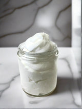 Elite Creed Natural Vanilla Buttercream Body Butter in Open Jar on Marble