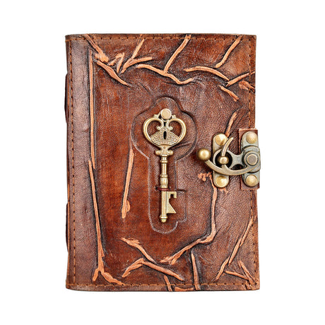 Embossed leather journal with metal key accent and secure latch, front view on white background