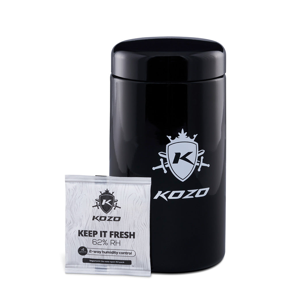 Kozo black UV glass storage jar in the 1 oz size with an airtight lid, front view on a plain white background
