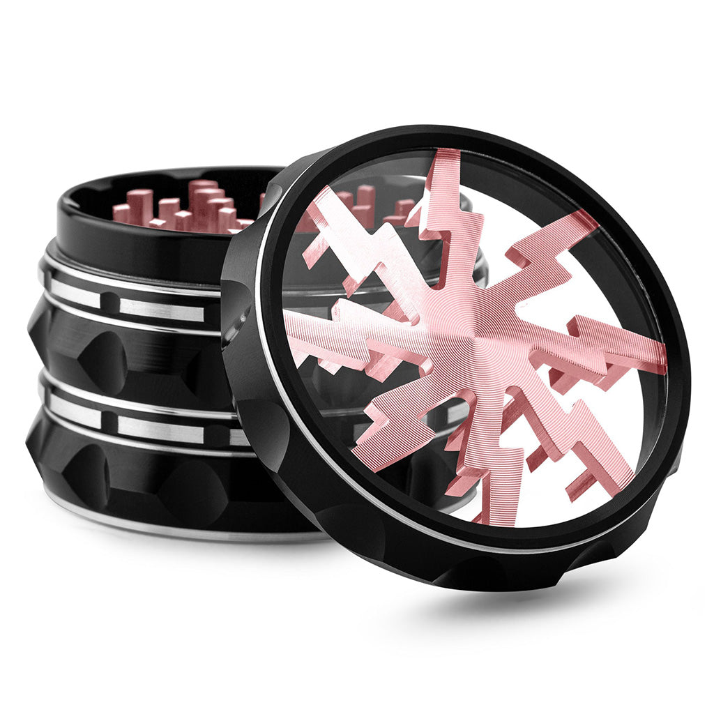 Kozo Lightning 2.5 inch grinder with a black body and rose gold lightning design, clear window lid tilted open