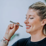 DynaVap The M 7 XL vaporizer lifestyle photograph showing the device on a plain surface, angle three.
