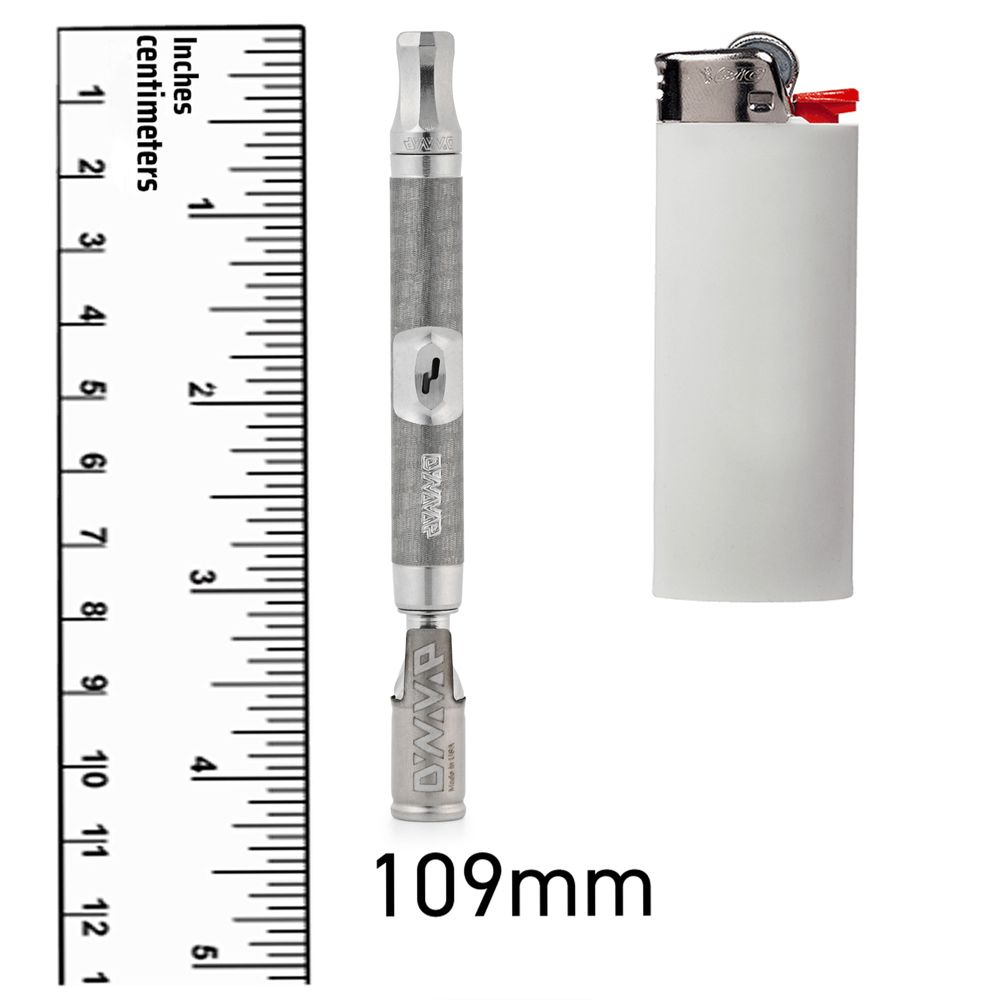 DynaVap The M 7 XL vaporizer photographed next to a scale reference to show its actual size and length.