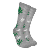 Mad Toro Socks with all-over green hemp leaf pattern on a gray background, angled view