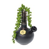 My Bud Vase "DeAngelo" black pipe with elegant vase design and greenery, front view
