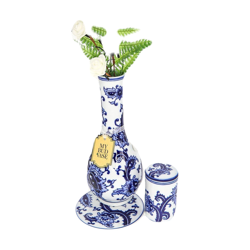 My Bud Vase "Joy" Bong in blue and white with floral design, front view with stash jar and fern