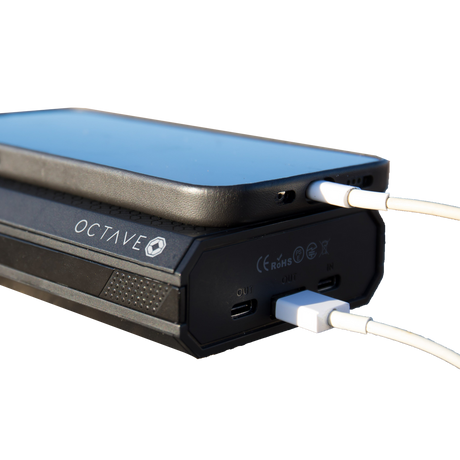 Octave Batt Pack Power Bank in Black, Side View with Cables Connected, Portable Travel Safe