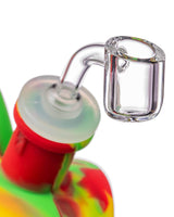 Close-up of Ooze Silicone Kettle Bubbler with Rasta colors and glass bowl, 45 degree joint